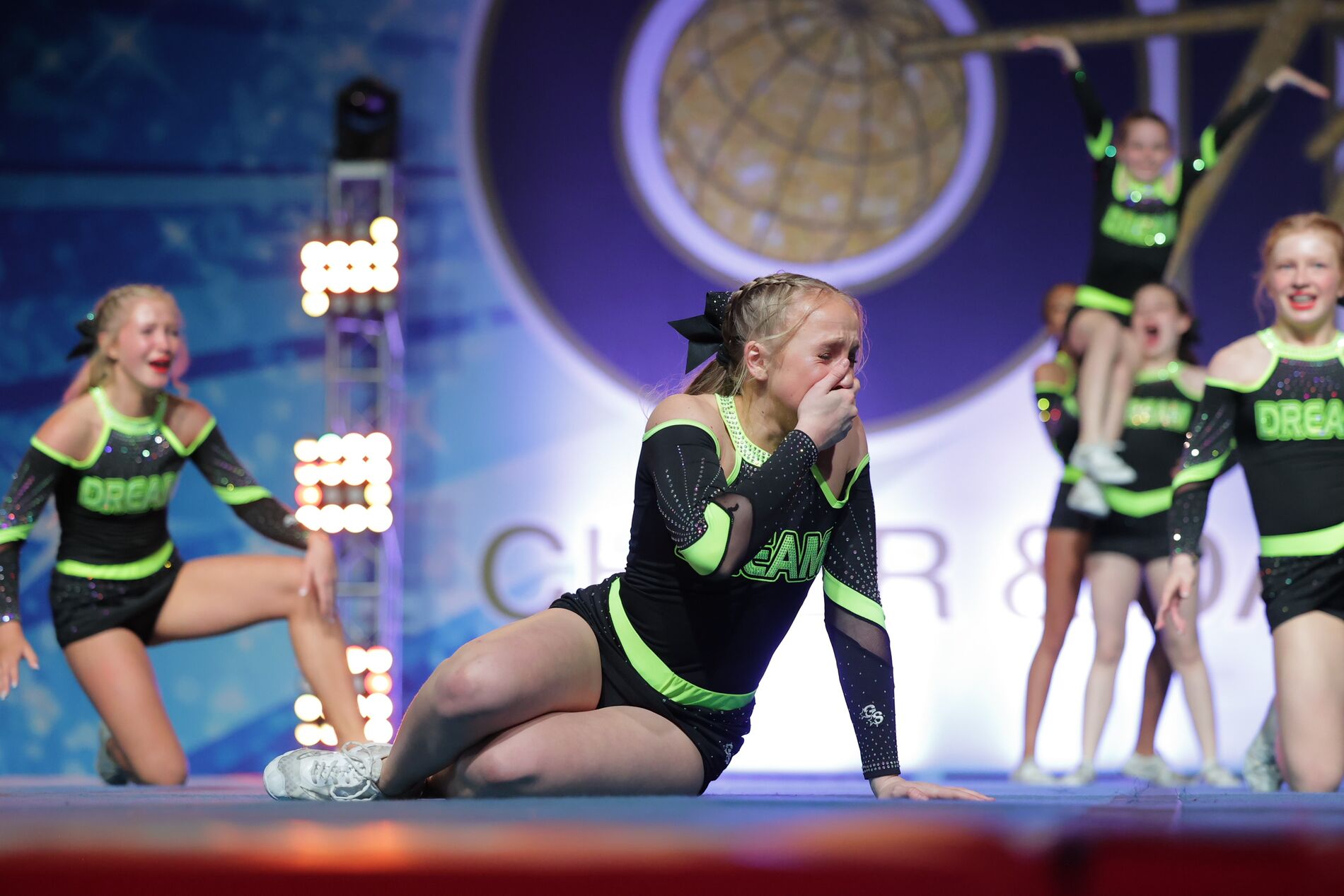 The Carolina Dream all star team hitting stunts on the competition floor